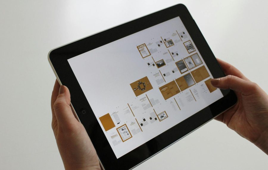 person holding black ipad